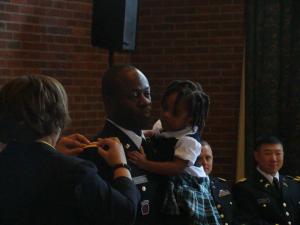 LT Sauders receivs his bars